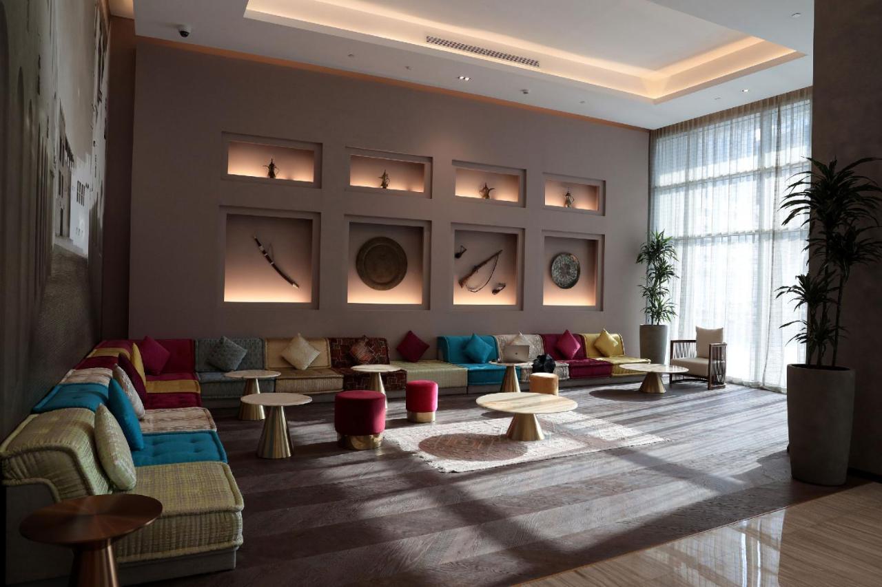 Pullman Sharjah Hotel Bagian luar foto The lobby of the hotel