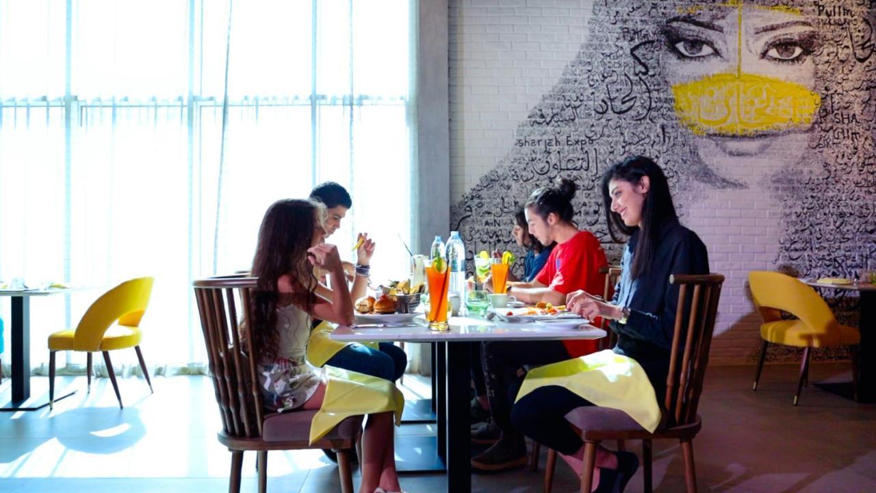 Pullman Sharjah Hotel Bagian luar foto The interior of the restaurant