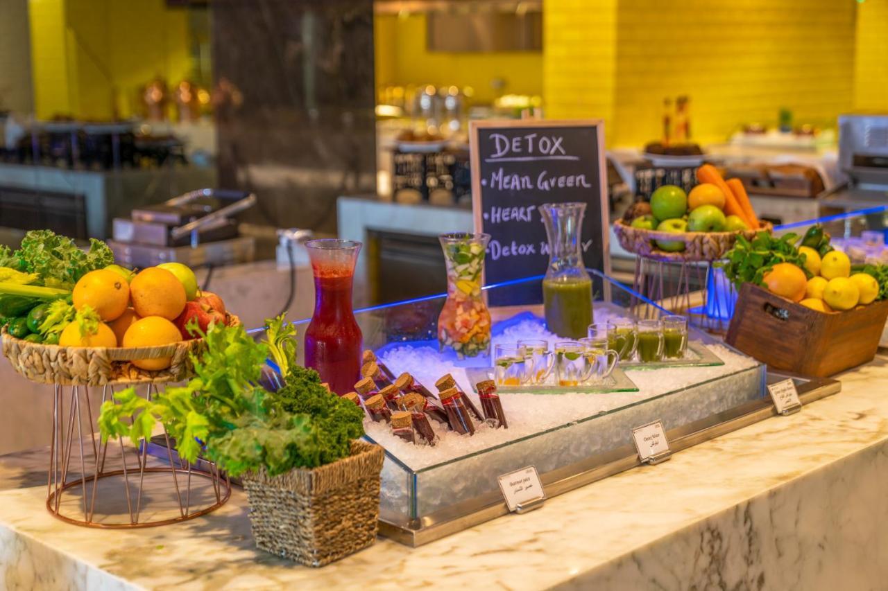Pullman Sharjah Hotel Bagian luar foto Healthy food at a buffet