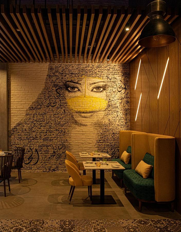 Pullman Sharjah Hotel Bagian luar foto Interior of the restaurant